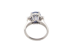 rear A fine platinum* ring. Features a lovely sky blue sapphire with 'star sapphire ' chatoyancy , measures 10x9mm, (est 4 carats) held by four claws, cabouchon cut