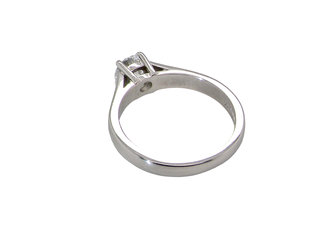 rear A fine solitaire ring, features an exceptional half carat diamond, brilliant cut, colour H-j, clarity VS2-Si1. Measures 5.2mm, depth 5.5mm, weight 4.9grams
