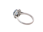 rear A fine vintage cluster ring centred with a deep blue aquamarine, measuring approximately 8mm and estimated at 2 carats, securely claw set.