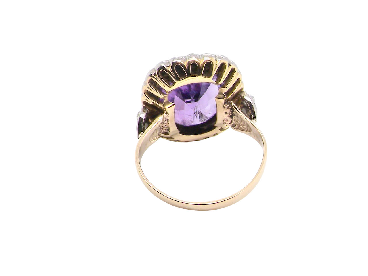 rear A fine vintage ring. Features to the centre a large cushion shaped amethyst, 13x10mm, rim setting.
