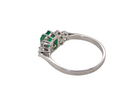rear A fine white gold* ring that features a rectangular emerald centre stone, measures 6x6.5mm (est one carat), mid to dark green hue, natural inclusions as with most emeralds.
