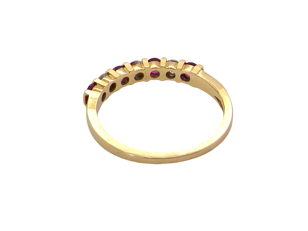 rear A half hoop 18 carat yellow gold eternity ring. Set with four bright red rubies, each 2.6mm (total carat weight 0.28 est)