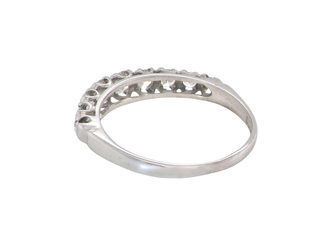 ring with a decorative openwork top band, photographed on a plain white background.