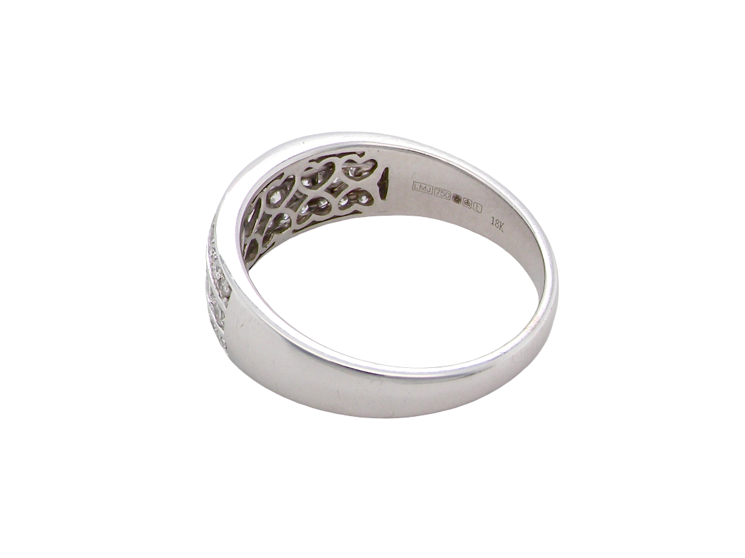 rear A lovely 18 carat white gold half hoop ring. Set with a middle row of nine bright white brilliant cut diamonds, graduate from 2.2mm to 2.6mm. The top and bottom rows are also set with small diamonds.