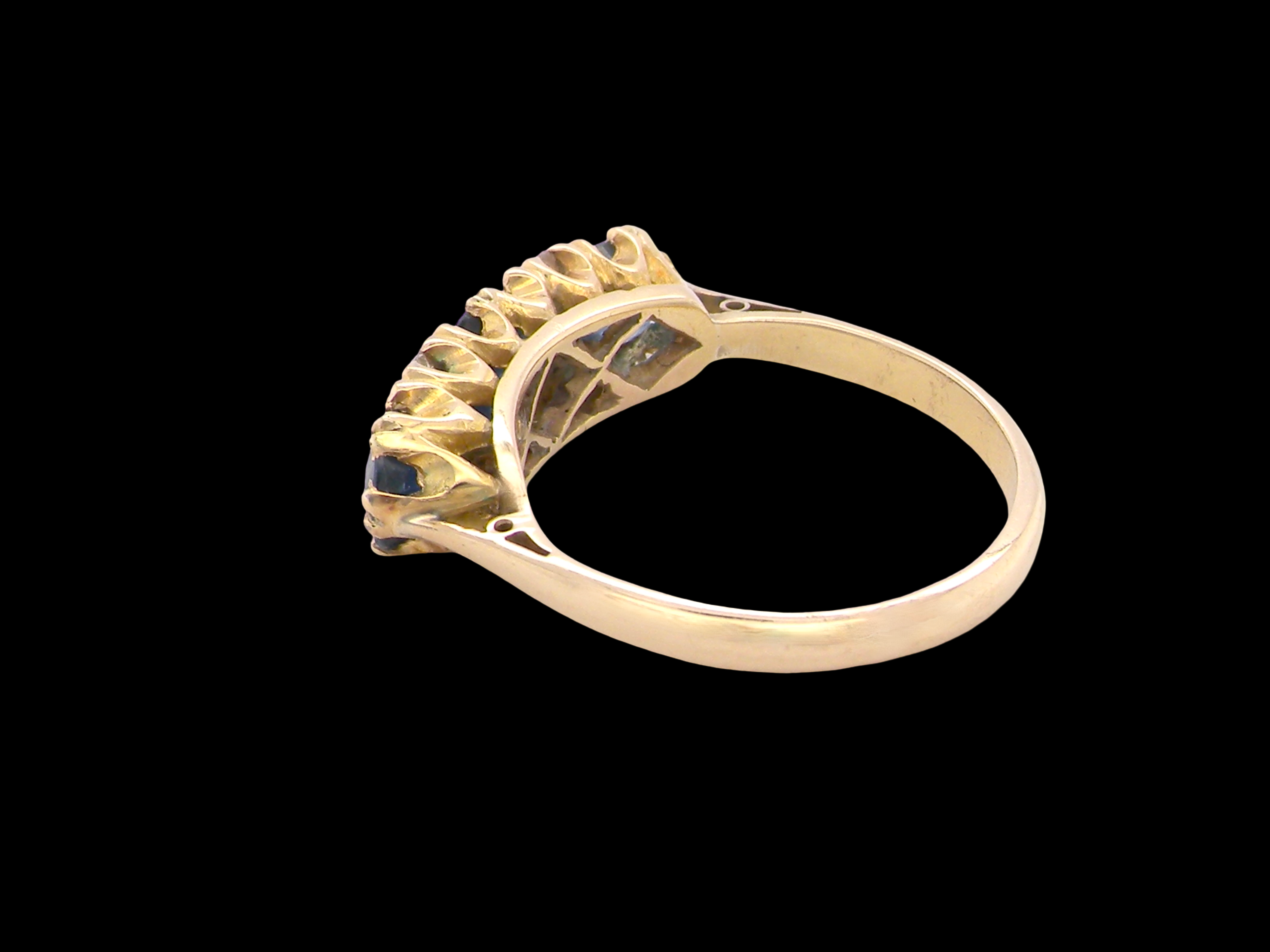 rear A lovely ring from the turn of the 19th century. Set with impressive round sapphires,