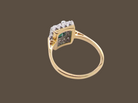 rear A near new cluster ring that shows no sign of wear, seems unworn.

Features a deep mint green tourmaline gemstone, 