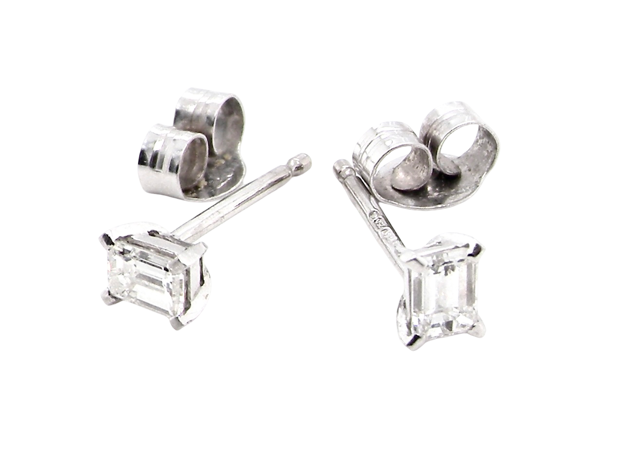 A pair of emerald cut diamond earrings