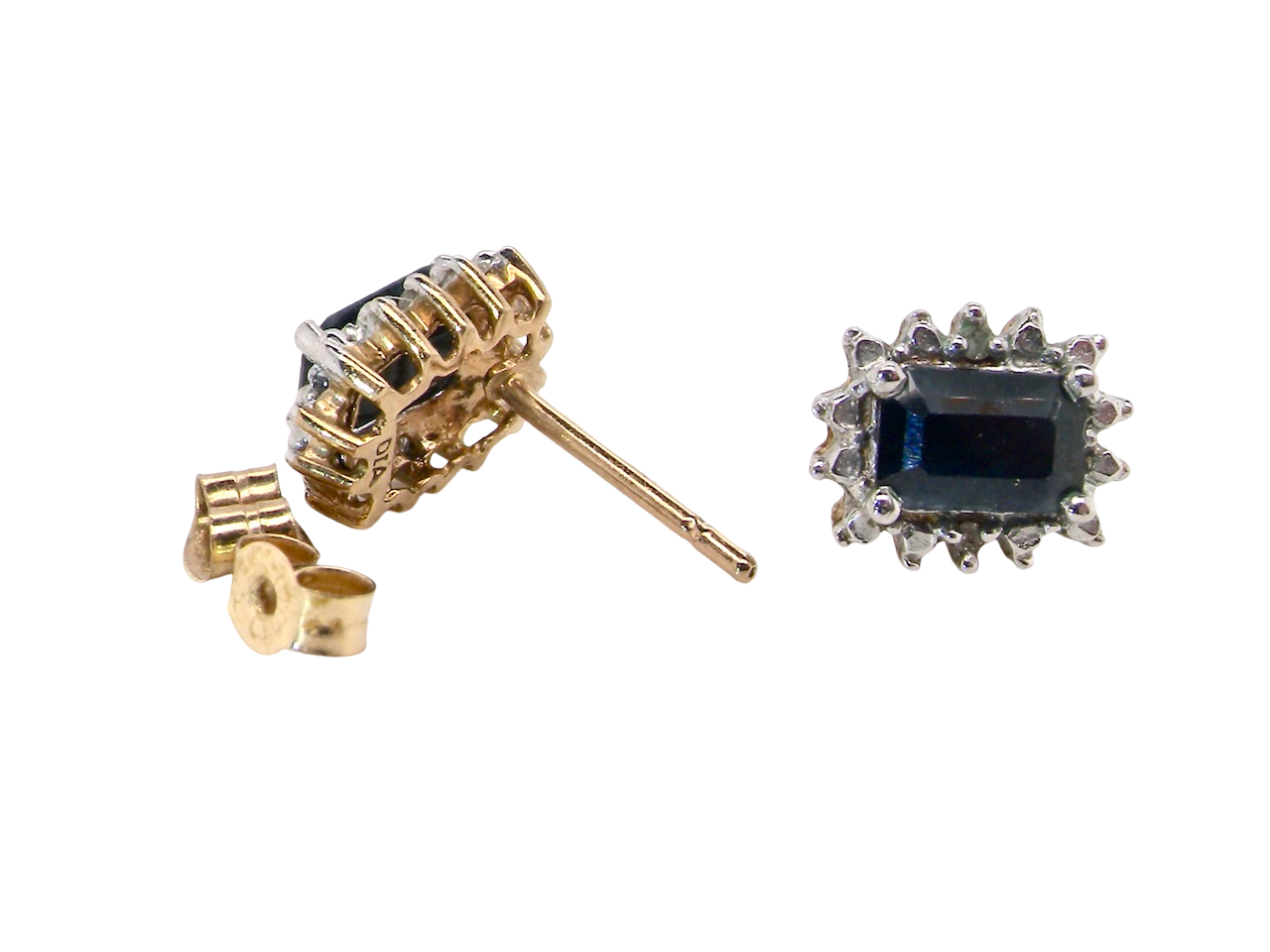 rear A pair of rectangular cluster earrings.

Each is set with a rectangular sapphire, ink black blue, 6x4mm. Around the edge an illusion of white dots and two small white diamonds.