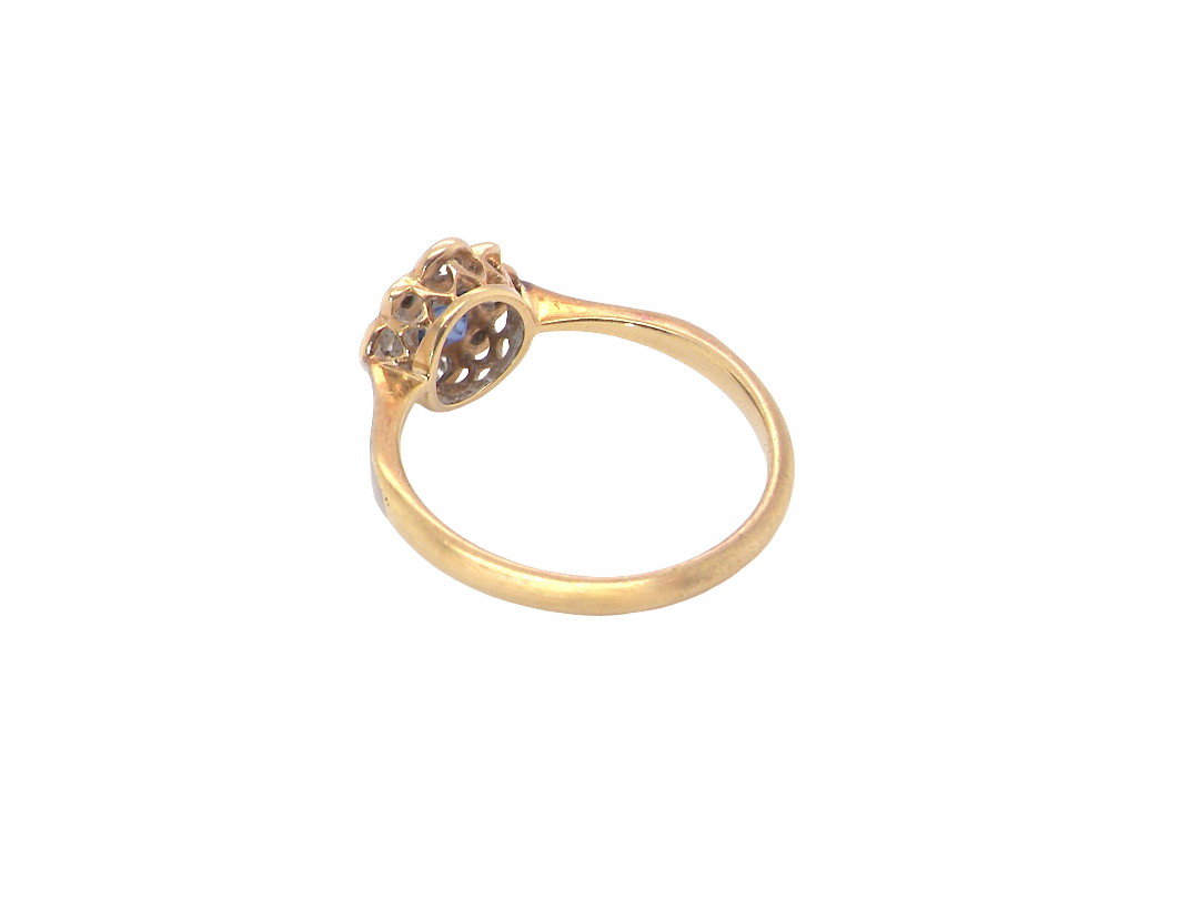 rear A pretty early 20th century cluster ring. The centre stone a square mid blue sapphire, 3x3mm, mille grain setting.&nbsp;