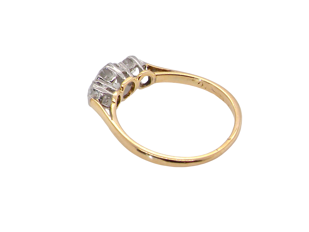 rear A pretty three stone trilogy ring that features three brilliant cut white diamonds.

Centre diamond, 5mm (est 0.50 carats) each side a 4mm diamond (est 0.25 carats). Colour G-h, clarity Si. Platinum rim style setting, head measures 12.7x5.3mm, depth 5.3mm, weight 2.4grams.