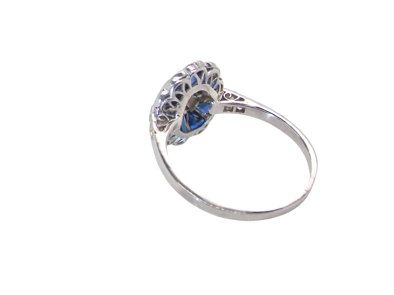 A highly unusual Art Deco cluster ring featuring a distinctive fan-shaped design.