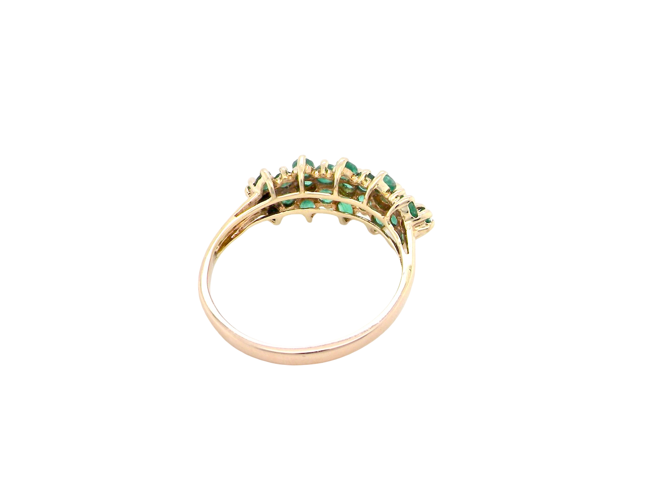 rear A striking and unusual dress ring, designed with multiple clusters of round-cut emeralds set beautifully across the finger for a bold, eye-catching look.