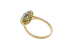 rear A stunning vintage cluster ring, set with an oval-cut emerald measuring 8 x 6mm, approximately 1.10 carats. The emerald displays a rich, deep grass-green colour with natural inclusions, typical of a genuine stone.