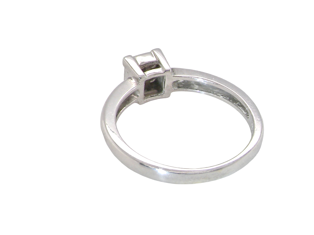 rear A stylish modern 18 carat white gold diamond cluster ring, with a beautifully clean and understated design.

The square-shaped head is set with four Princess cut white diamonds,