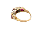 rear A superb Victorian ring, carved boat shaped head. Set with three fine rubies , 