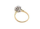 rear A traditional cluster ring. Features to the centre a 3.4mm brilliant cut white diamond (est 0.15 carats)

Surrounded by six 3.4mm diamonds to match