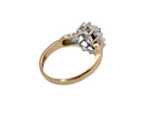rear A traditional cluster ring that features to the centre a dark black blue oval cut sapphire 7x5mm (est 3/4 ct) claw set.