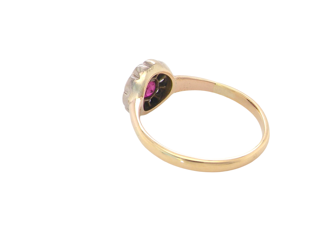 rear A very pretty vintage daisy cluster ring. Features to the centre a round pink red ruby that measures 4mm, and is mille grain set.
