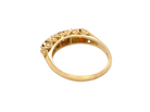 rear A vintage style 18 carat gold boat shaped ring. Features three dark red garnets, centre 4mm, each end a 3mm stone.&nbsp;
