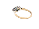 rear A vintage three stone ring. Features to the centre a 6mm natural blue zircon, 6mm diameter, claw set.