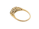 A yellow gold ring with an intricate filigree crown featuring small dark blue gemstones, shown on a plain white background.