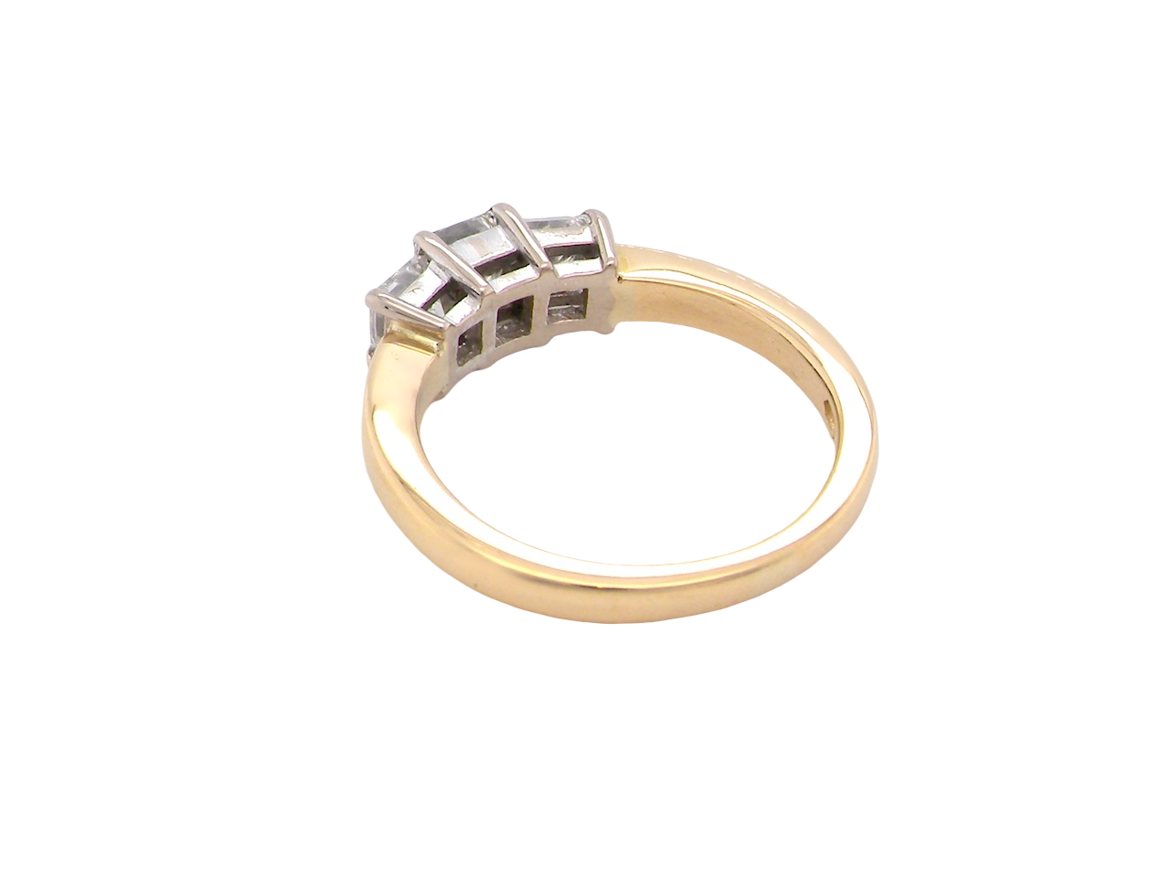 Gold ring with diamond accents on a white background
