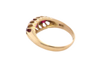 rear An 18 carat gold antique boat shaped ring. Features three lovely coloured wine red rubies, centre 5x4mm, each end 2.4mm.