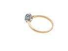 rear An 18 carat gold cluster ring. Set to the centre a lovely ice blue aquamarine 6x4mm, claw set.
