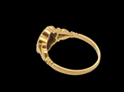 rear An 18 carat gold cluster ring.&nbsp; The centre a floral combination of seven sapphires, each 2.5mm, mid to dark blue.
