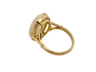 rear An 18 carat yellow gold* dress ring set with a large oval opal gemstone.