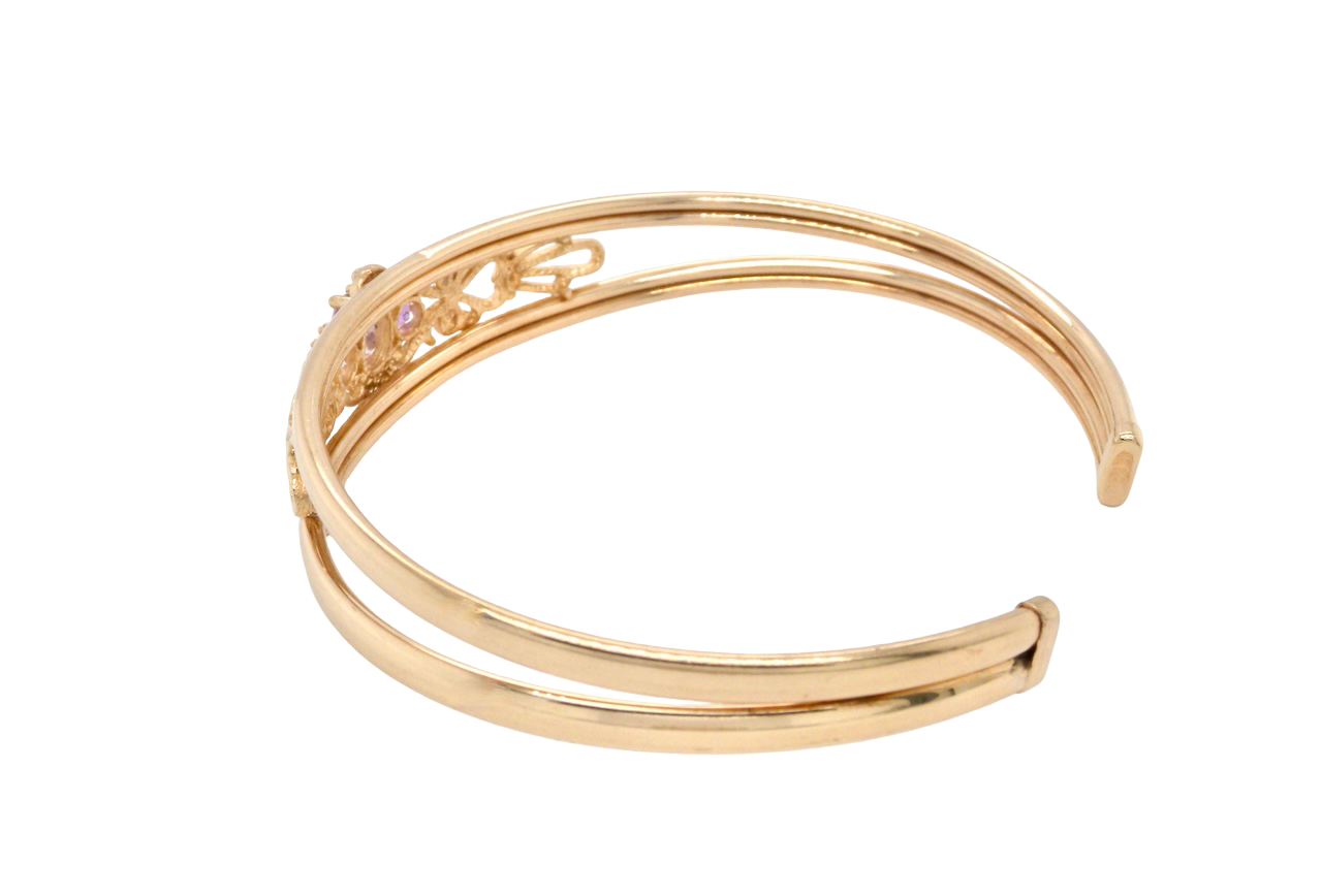 Gold bracelet on a white background