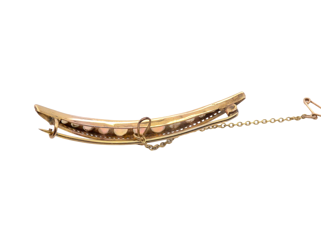 An Edwardian opal crescent shaped brooch
