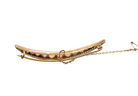 An Edwardian opal crescent shaped brooch