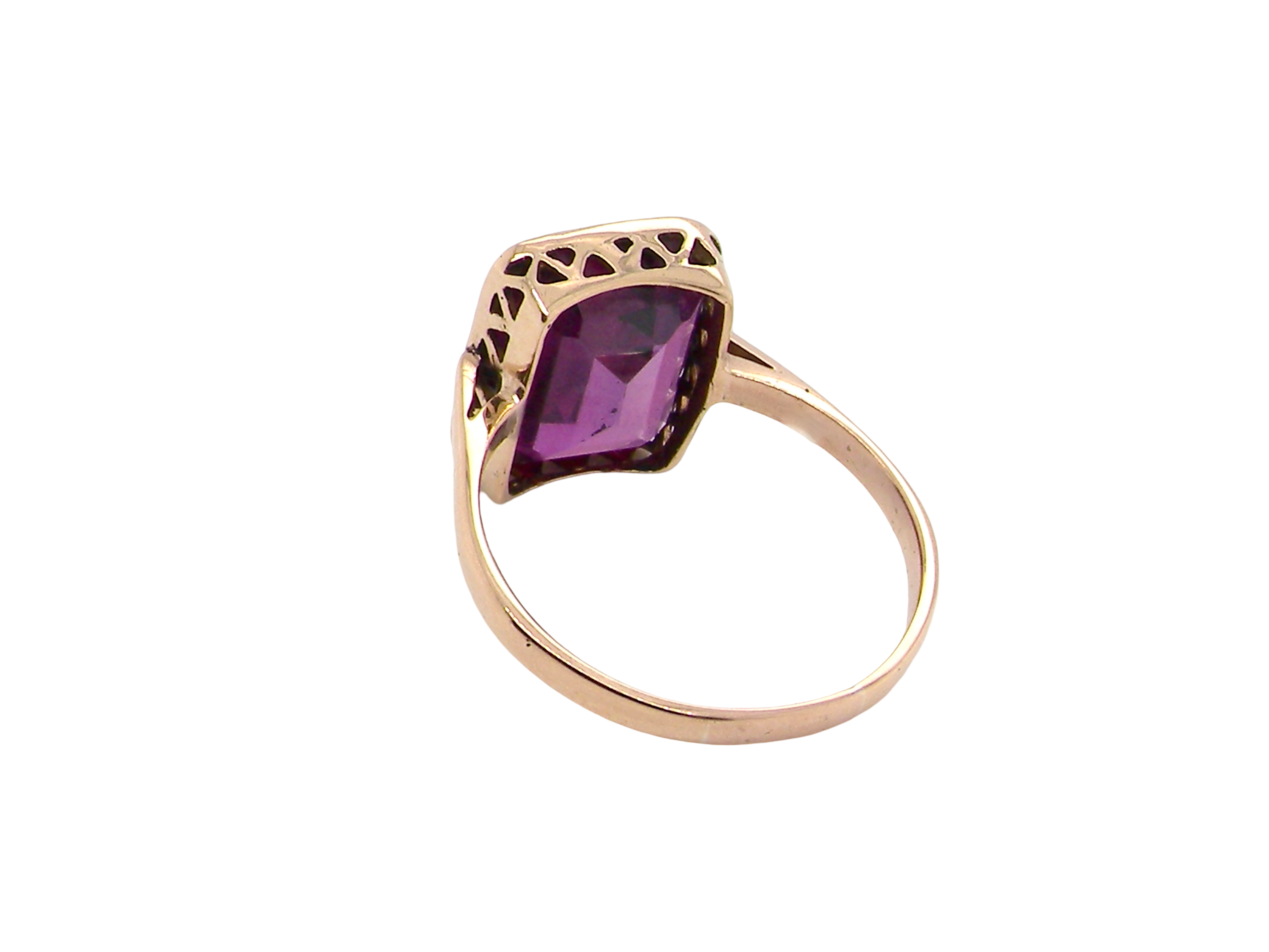 rear An antique dress ring that features a rectangular cut amethyst. Very dark purple, measures 12x10mm. Rim setting.
