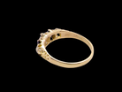 rear An antique ring from the early years of the 20th century. Centre stone 5mm diameter (0.50 carats) Colour H-j, clarity Si. Each side&nbsp; a mid colour blue sapphire 4mm diameter.

