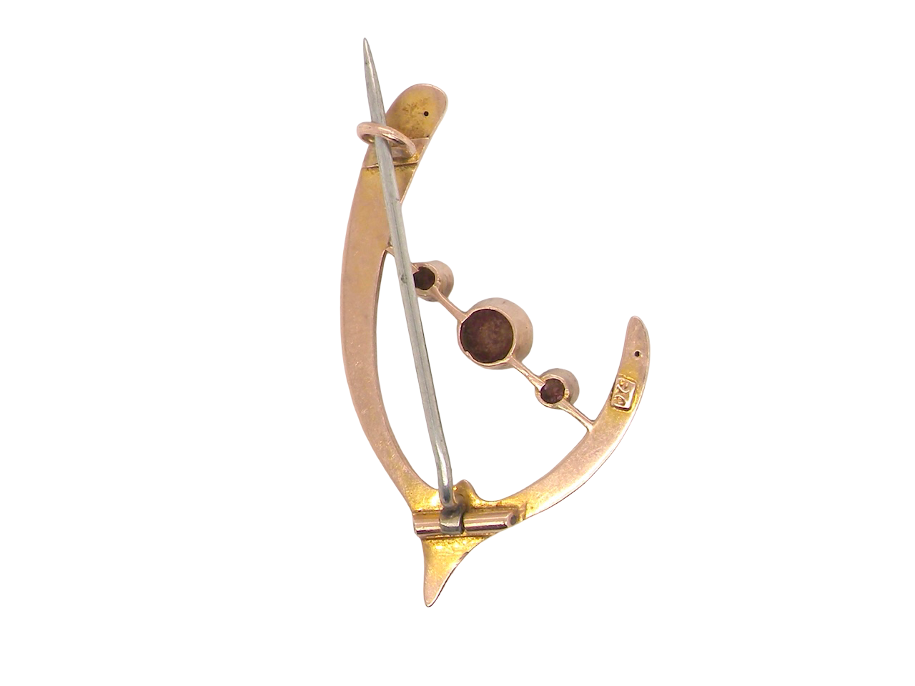 An antique wishbone shaped brooch