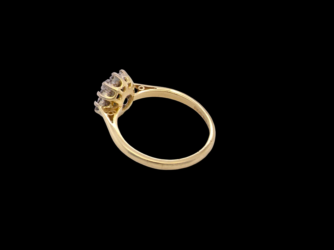 rear An elegant 18 carat gold cluster ring featuring a beautifully proportioned 6 × 4mm green tourmaline 