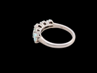 rear An elegant opal and diamond half hoop ring, featuring five oval opals with lively play of colour. Each opal measures 5 x 3mm, with an estimated total opal weight of approximately 0.75 carats, all claw set to maximise light and colour.