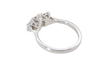 rear An exceptional three stone diamond trilogy ring, beautifully crafted in platinum and set with three modern brilliant cut white diamonds.