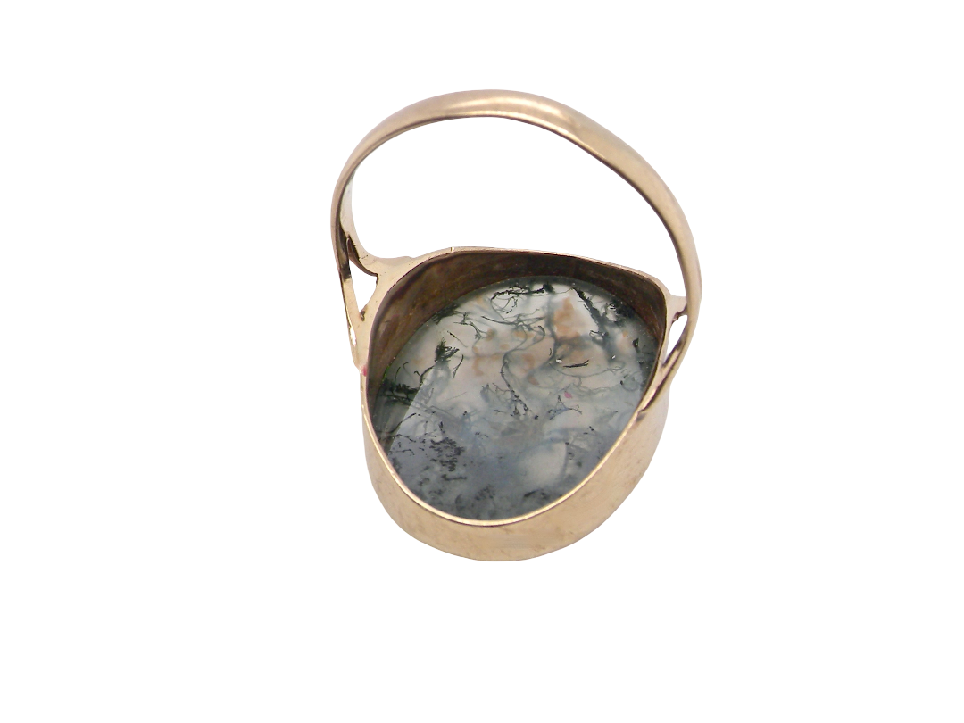 rear An impressive dress ring set with a large moss agate semi precious gem stone.