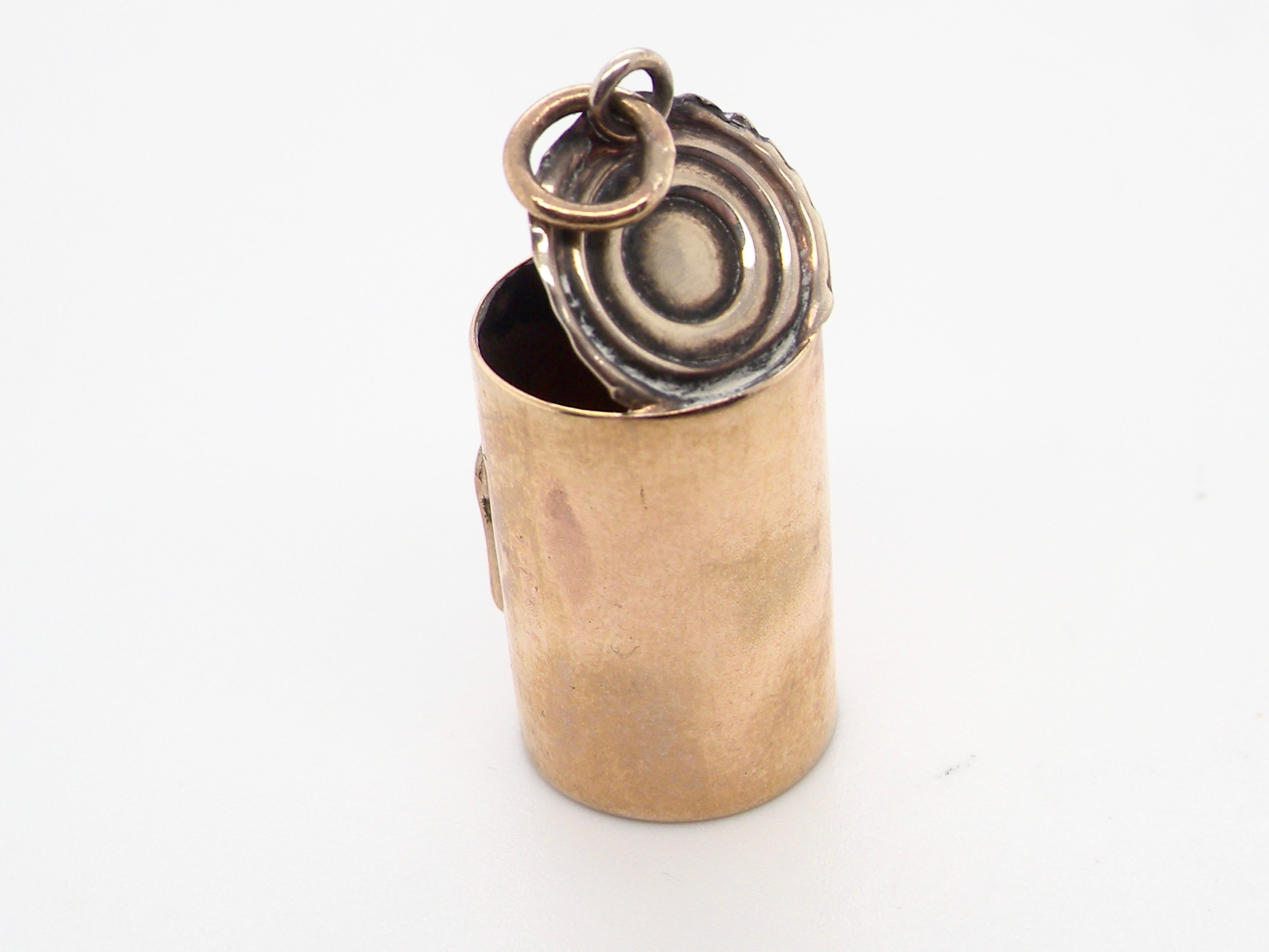 rear An unusual 9 carat gold charm . Shaped as a baked bean can,