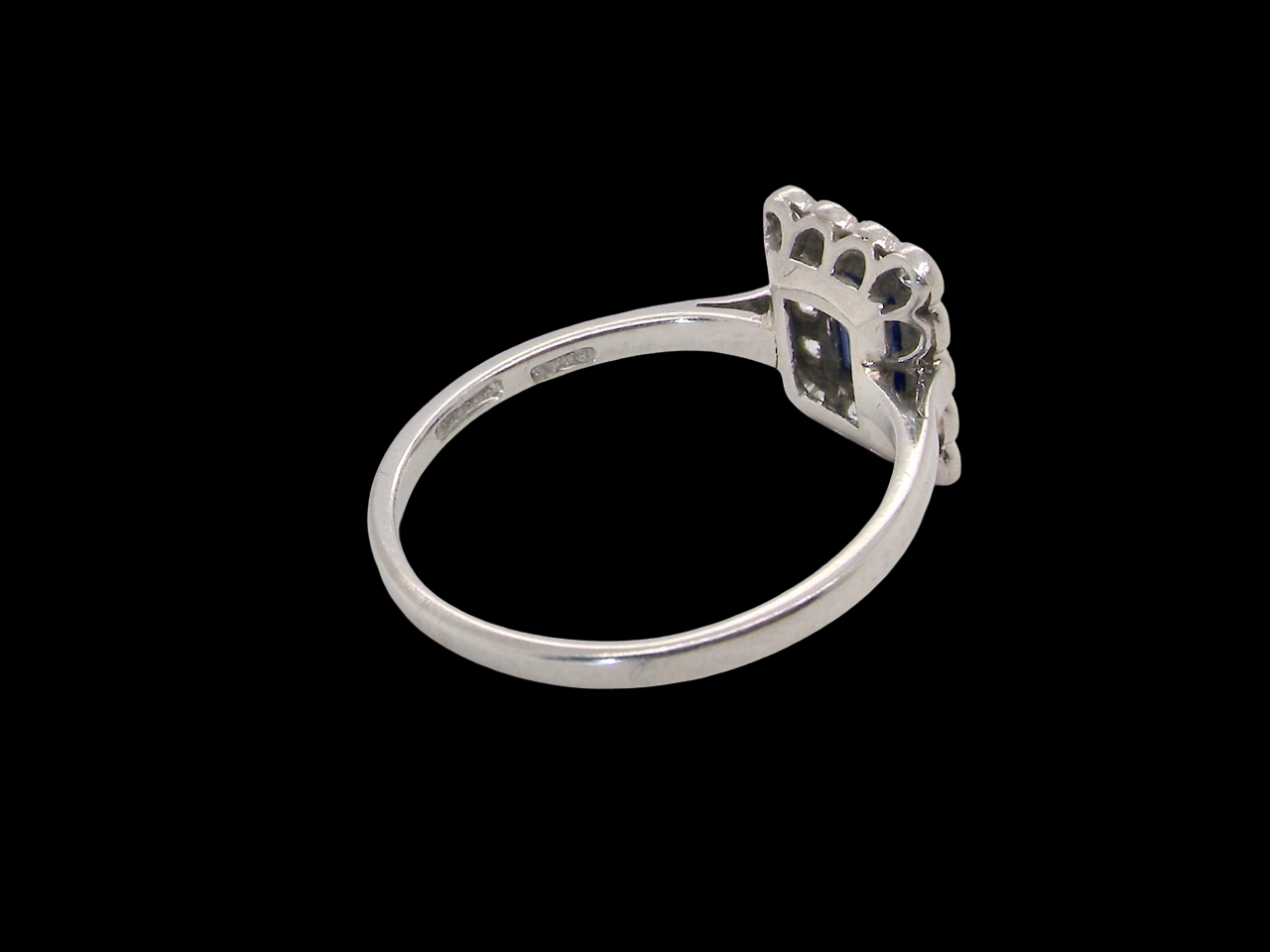 rear  Art Deco cluster ring. Features a cobalt blue sapphire 