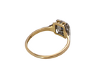 rear antique cluster ring. Features a small square sapphire