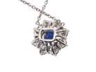 rear beautiful new 18 carat white gold cluster pendant, showcasing a vibrant blue sapphire at its centre.