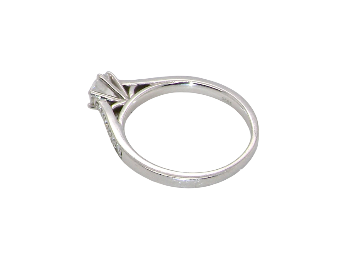 rear  beautiful platinum solitaire ring featuring a brilliant-cut white diamond, claw set, measuring 4.8mm and weighing approximately 0.65ct. Diamond graded I colour, SI1 clarity, with an 88-facet cut.