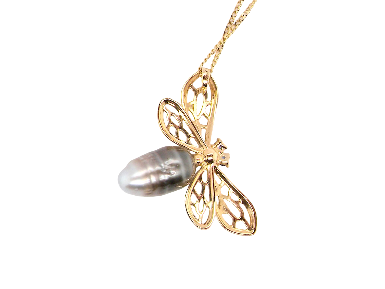 rear  double winged dragonfly. The body is a baroque shaped pearl, shades of grey, brown to black 