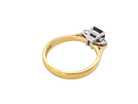 rear elegant 18 carat yellow gold trilogy ring featuring a striking natural sapphire at its centre