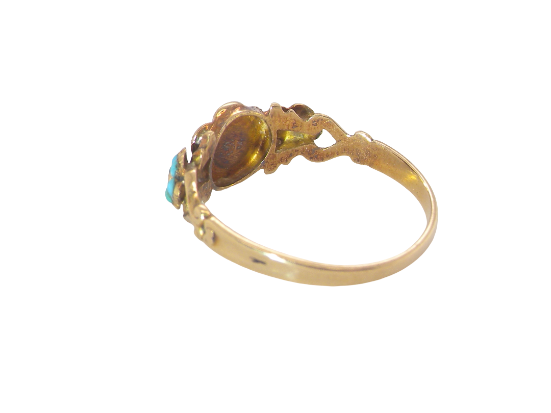 rear pretty Victorian dress ring. A daisy cluster design with an emerald centre stone, measures 1.8mm, surrounded by six tiny seed pearls, each 1.8mm
