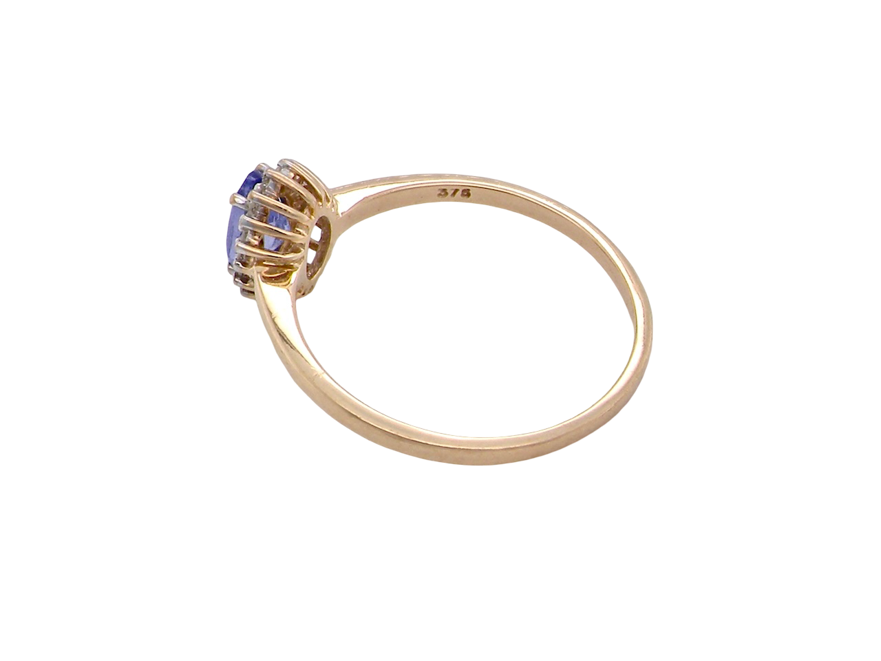 rear pretty cluster ring that features an oval cut tanzanite gemstone,
