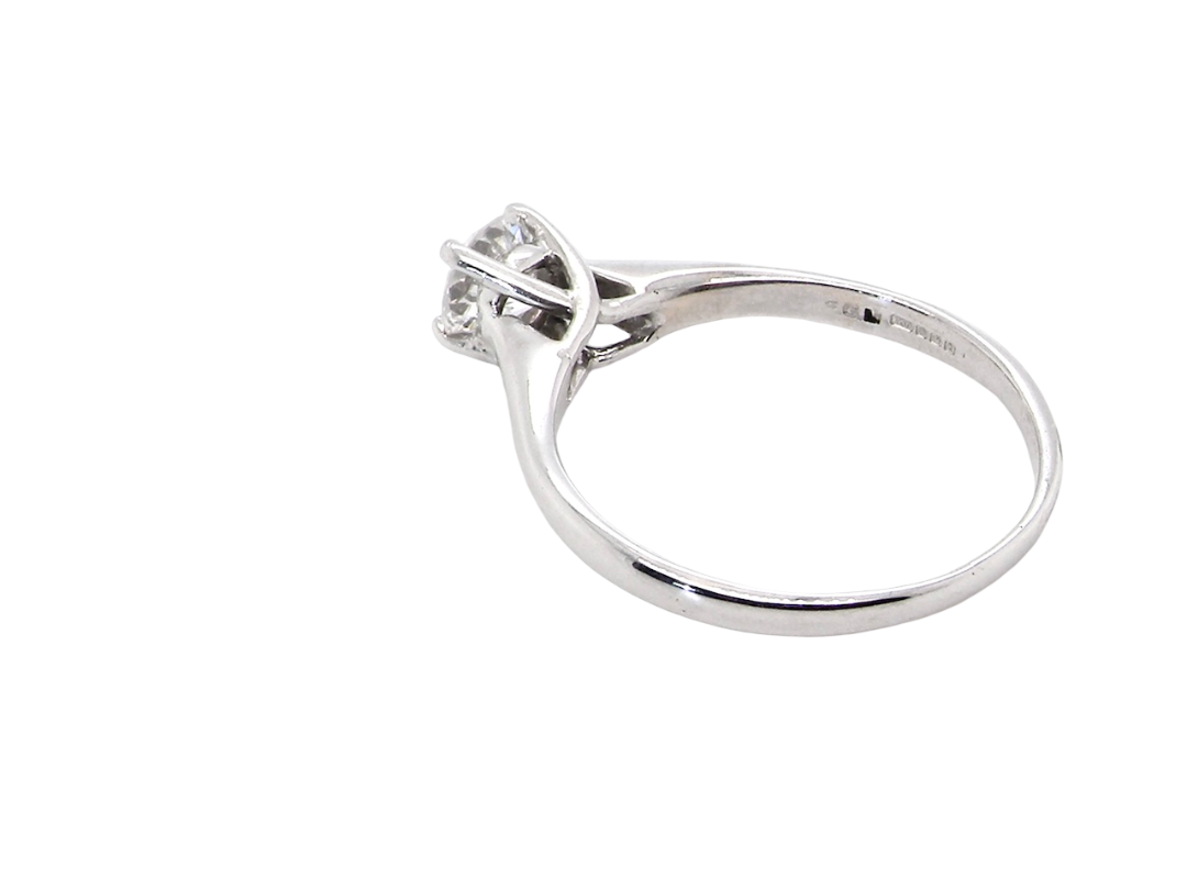 rear  solitaire ring containing a fine modern brilliant cut white diamond. Measures 5.4mm (.53 carats)

Colour G-h, clarity Si. Modern feature under setting, depth 6.8mm, weight 2.6grams.
 